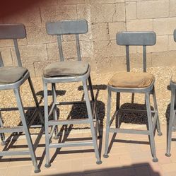 Four steel Vintage high top stools