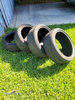 Set of 4 Goodyear Tires P235/40R19 25% tread