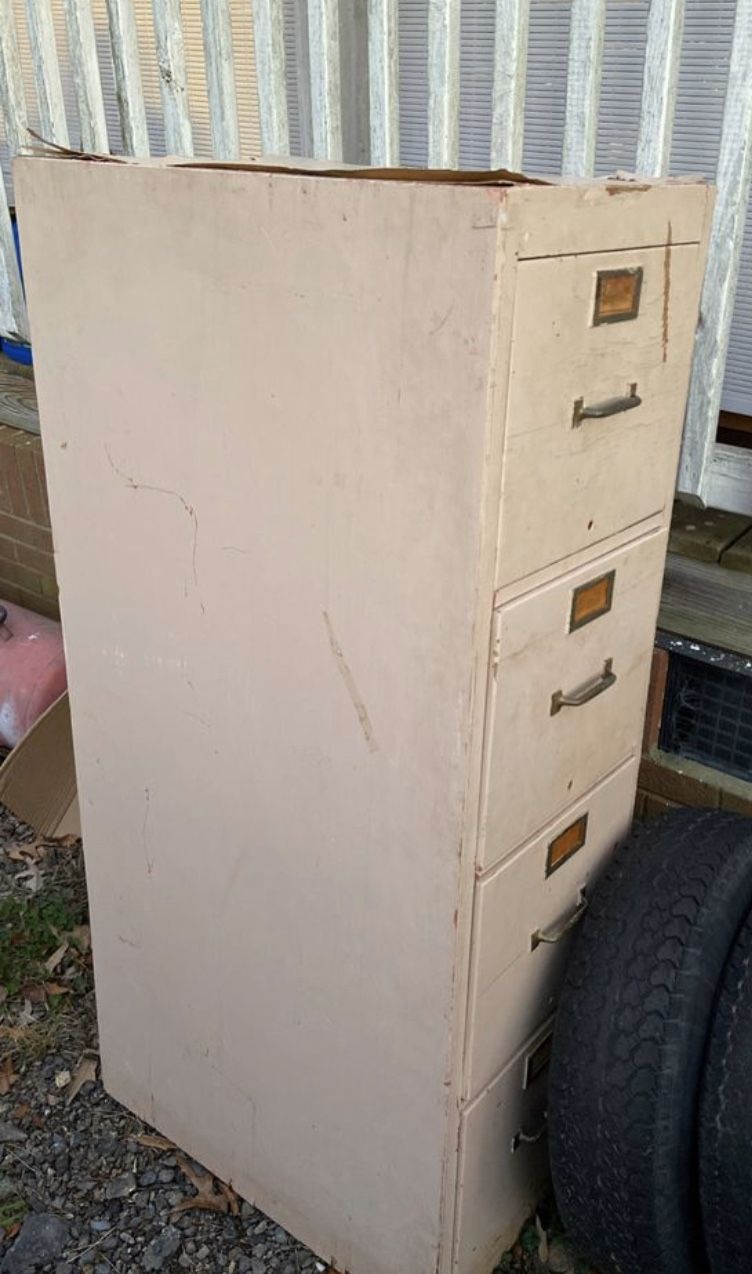 Older metal wood filing cabinet needs TLC works fine