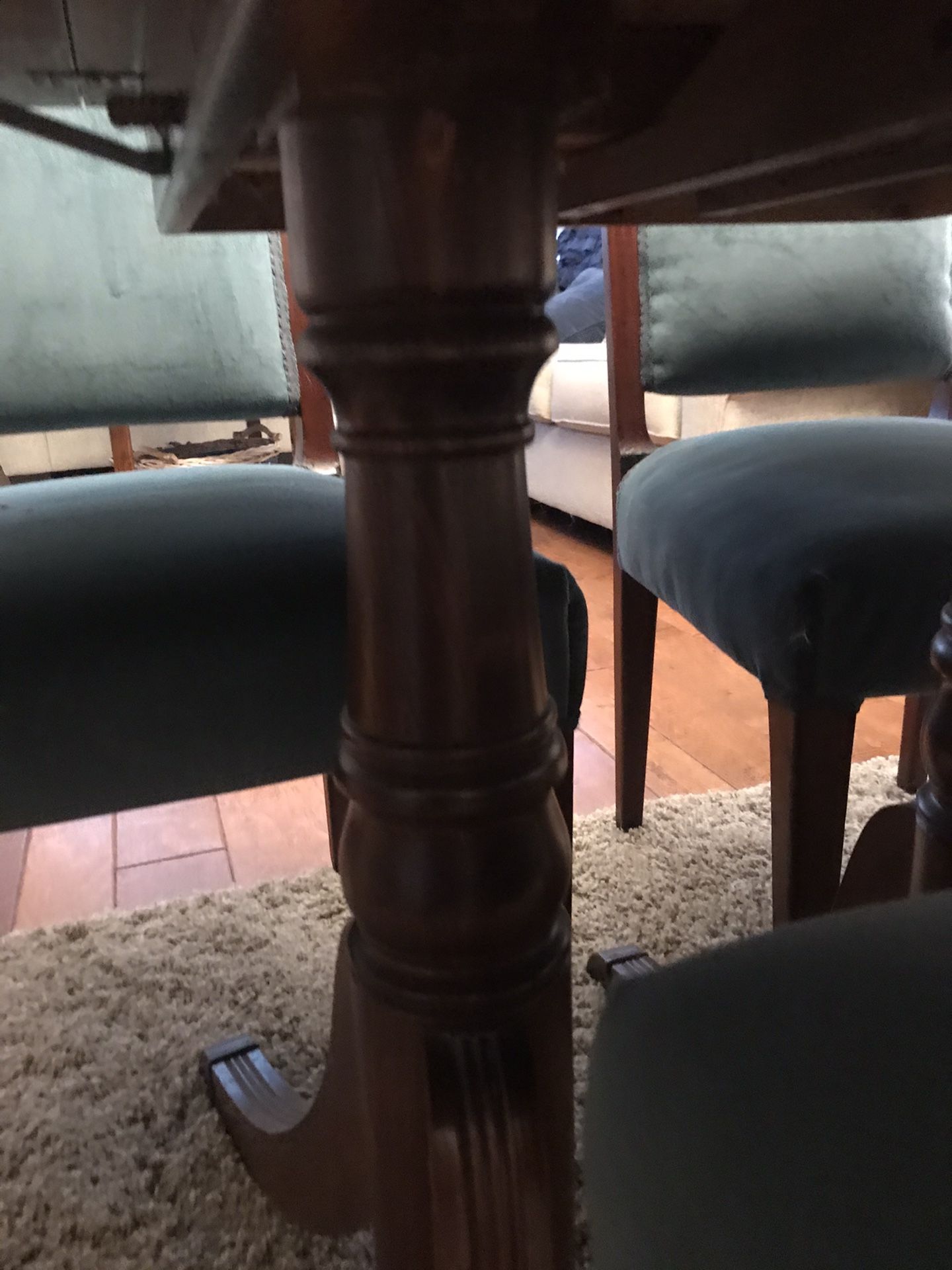 Antique dining table and 6 chairs. Slight repair needed on one chairs upholstery coming loose from frame.
