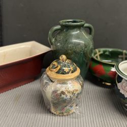 An Assortment Of Flower Pods, Vases Bowls, And Small Artistic Pieces