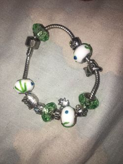 Silver, white, and green pandora bracelet