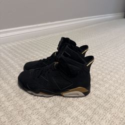 Jordan 6 Trainers in Black and Gold