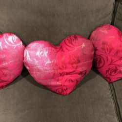 Three decorative pillows.