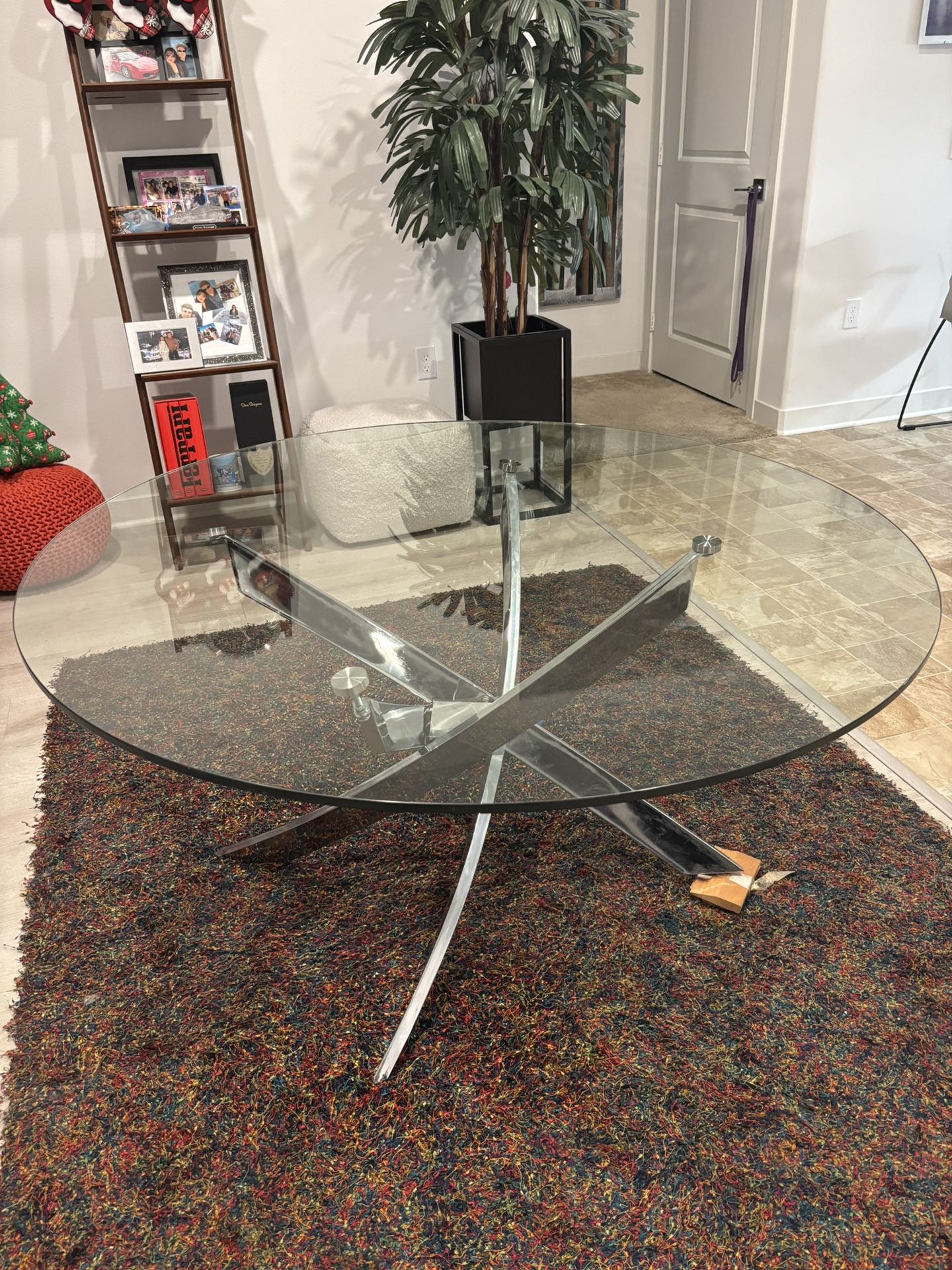 Modern circular dining table with glass top