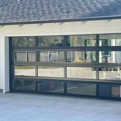 Full View Garage Doors with black frame and glass