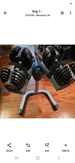 Nautilus adjustable 5 to 52.5 pound dumbells with stand.