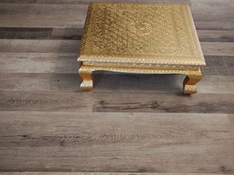 Ornate Gold accent table with intricate embossed design