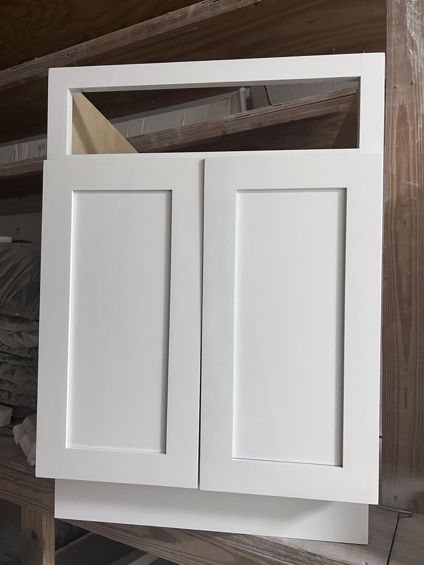 White wooden kitchen cabinets for bathroom and kitchen. of different measures