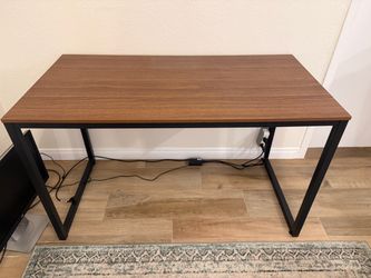 Modern walnut office desk with black metal frame