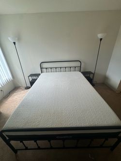 Queen bed frame and mattress, nightstands, and floor lamps