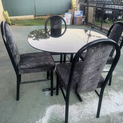 Glass Dinning room Table With 4 Chairs.