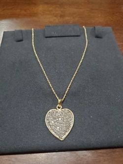 10k gold diamond accented heart pendant w/ 18inch 14k gold chain.