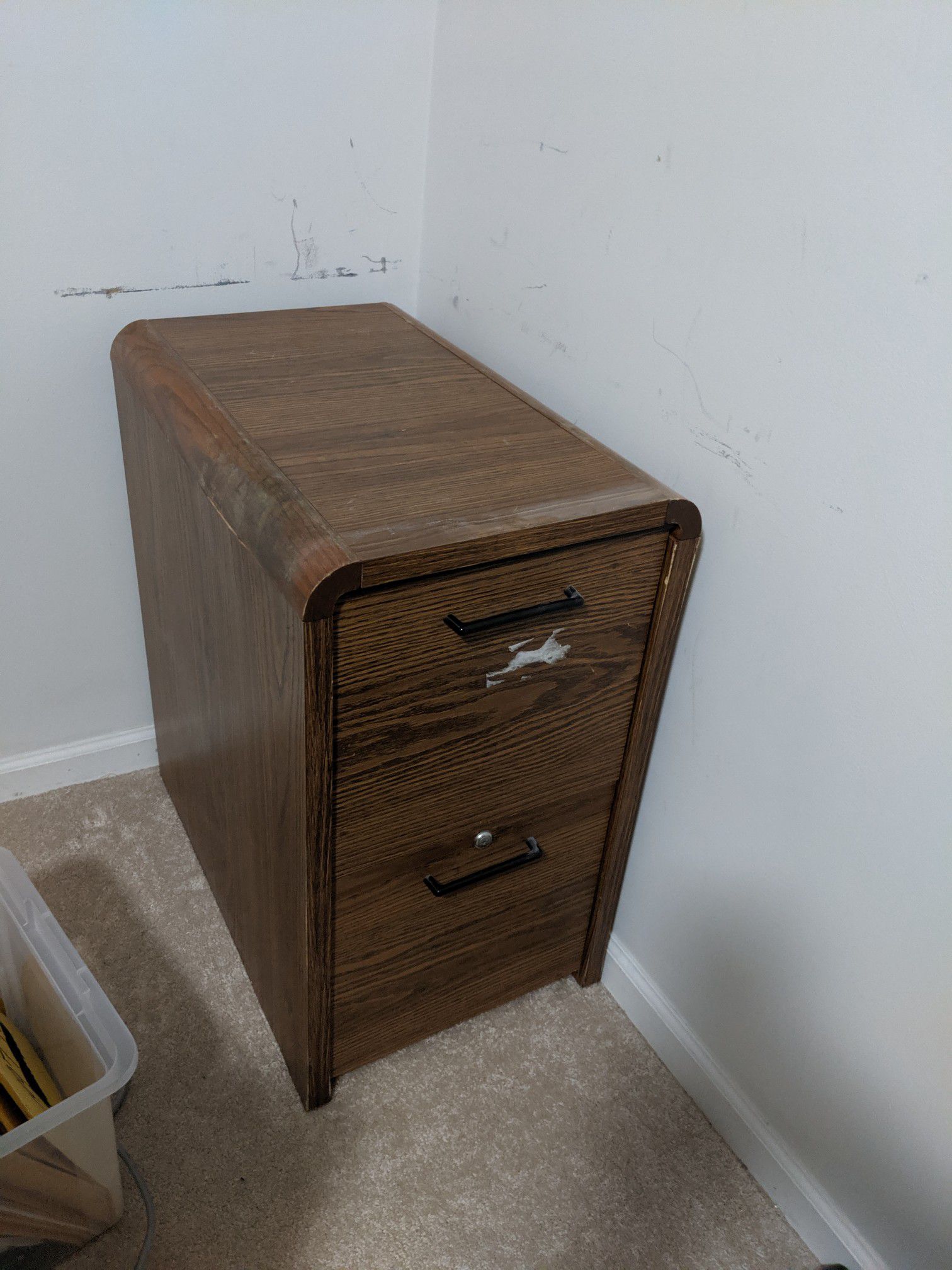 Very heavy, well made file cabinet. 2 fully functional drawers. Some wear and tear and little water damage on the top.