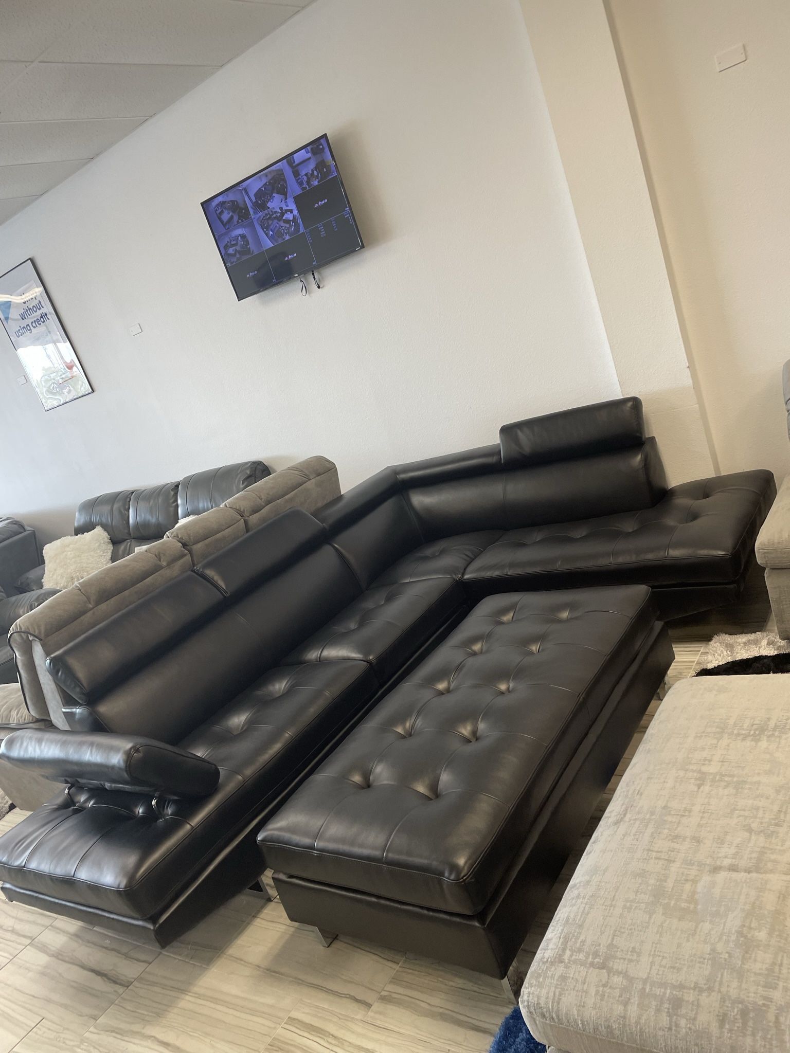 Going out of business sale. Ibiza black sectional with ottoman set $899. Easy finance option. Same day delivery.