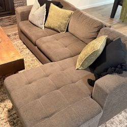 Grey sectional with storage & pull Out bed 