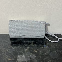 silver glitter envelope clutch bag. 