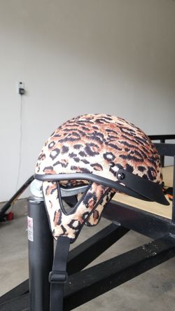 Leopard print motorcycle helmet.