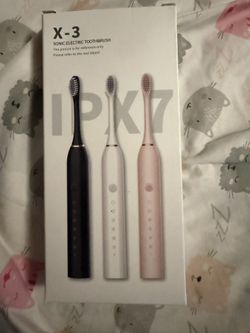 Electric Toothbrush With 3 Brushes.