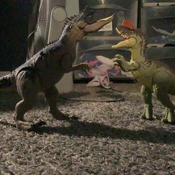 Two Dinosaur Toys Made By Matel