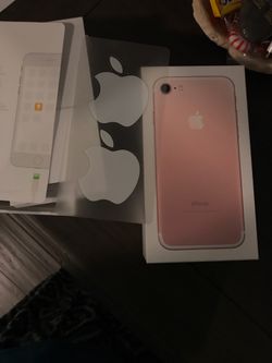 Empty iPhone pink box with Apple stickers