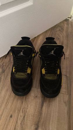 Air Jordan retro 4’s black and yellow