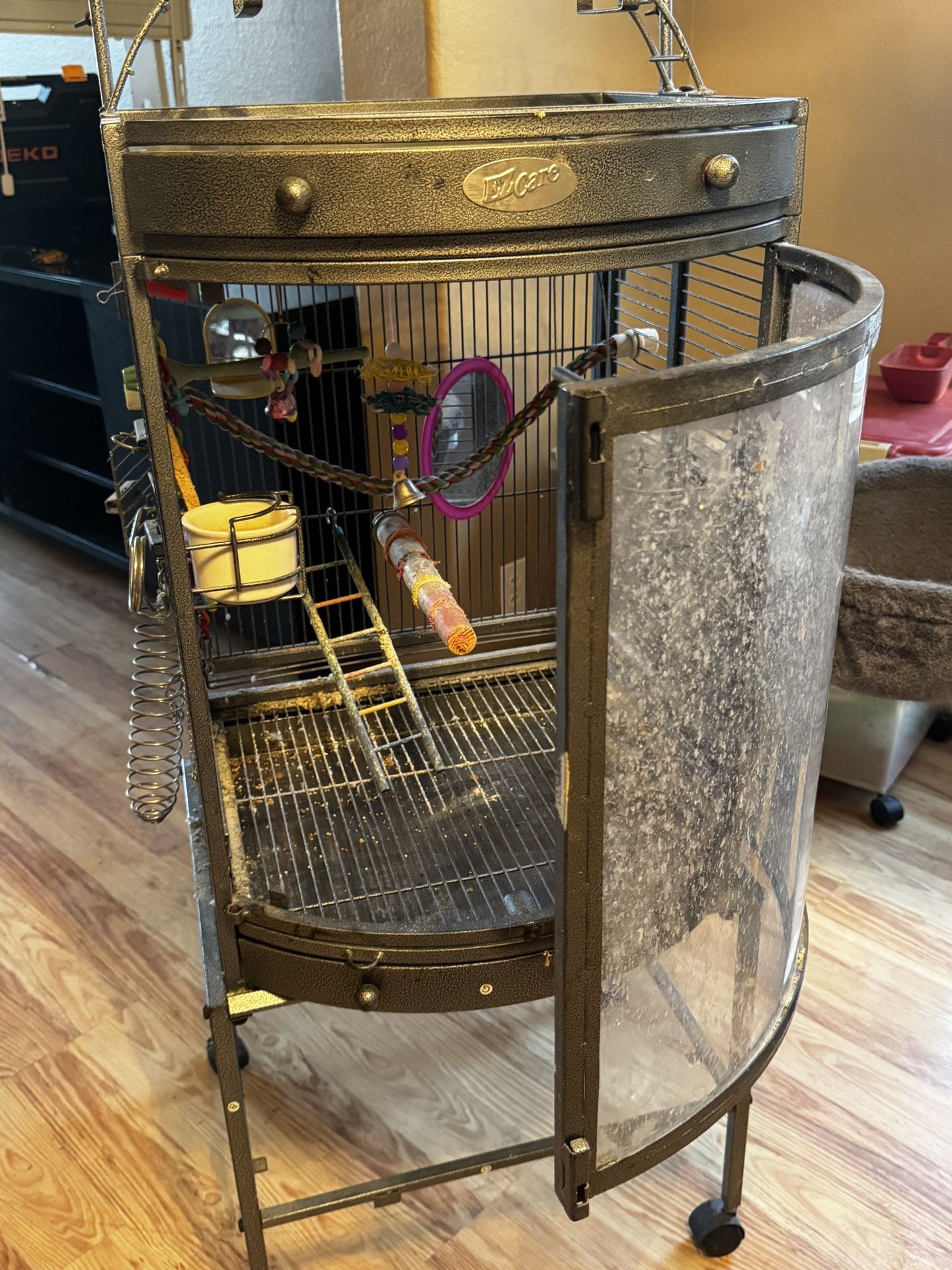 Metal bird cage with plexiglass front good for parakeets or cockatiels