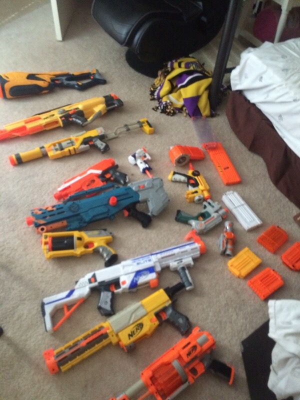 12 Nerf guns + ammunition and attachments $300 worth of Nerf guns at least