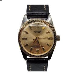 Bring classic mid-century style to your wrist with this vintage Genova De Luxe mechanical wristwatch. Featuring a distinctive fluted bezel, a radiant