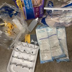 NEW Postpartum Items (disposable diapers, peri bottle, peri cooling pads), bottle drying rack, medela pump parts and baby bottle