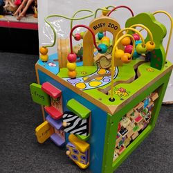 "Busy Zoo Wooden Activity Cube," also known as the "B. toys Zany Zoo Wooden Activity Cube".