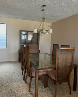 Glass dining room table with chairs