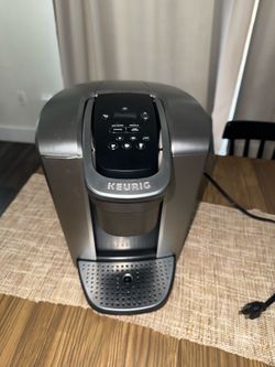 This is a Keurig K-Elite single-serve coffee maker in a brushed finish