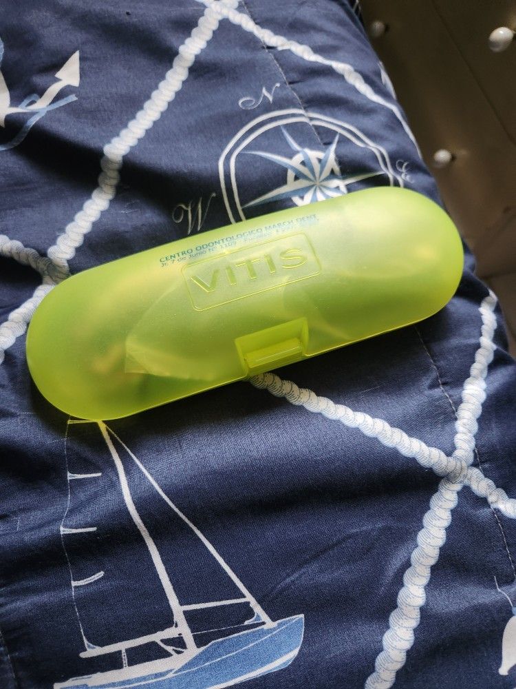 Two necklaces with fang pendants and beads.
A bracelet made of multicolored threads.