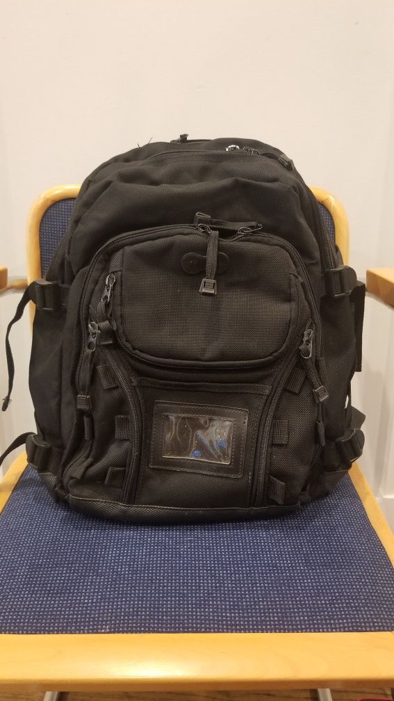 Black backpack, various compartments, outdoor, travel, hiking, school, work