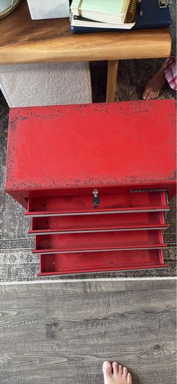 Red craftsman metal tollbox 4 drawers by 22”x12”