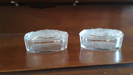 2 vintage oval glass boxes with flower designs on top