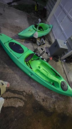 2 kayaks and wheeled dollies for walking to lake or on trail