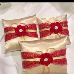 Red and gold with a rhinestone centerpiece 3 tiara pillow set.