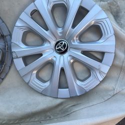 Toyota hubcaps 2 both useful for a car with some curb rash 