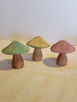 3 decorated mushrooms. 3 1/2 inches tall.