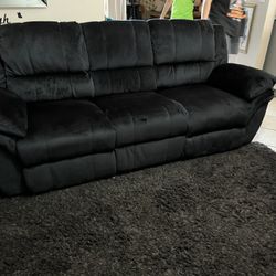 New Reclining Couch .  Black Padded Suede.  Free Delivery !