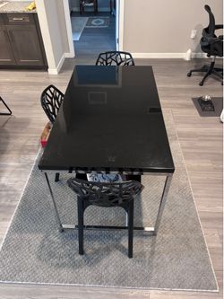 Black and Chrome Dining Table with 3 Geometric Chairs