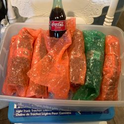 22 collectible Coca-Cola glass bottles