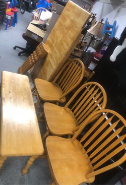 36”x60” solid wood table with bench and three chairs very good condition
