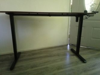 desk high. Low adjustable. 55" by 24"