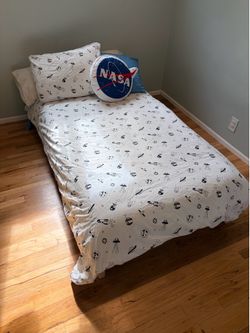 Stackable twin bed frames and space themed bed linen set