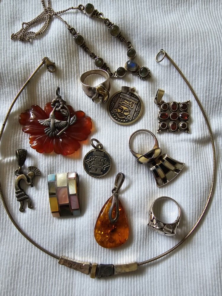 Varied Jewelry pieces. All Set In Silver.