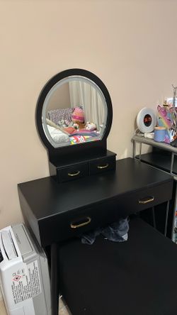 Black vanity with chair and LED mirror