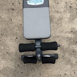 This Is A Flat Bench For Bench Pressing And Is Also A Stomach Machine For Doing Abs
